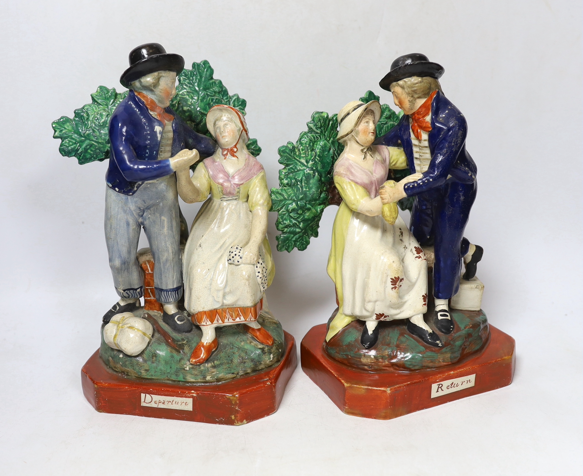 A pair of Staffordshire pearlware sailor groups 'Departure' and 'Return', c.1820, largest 23cm high
